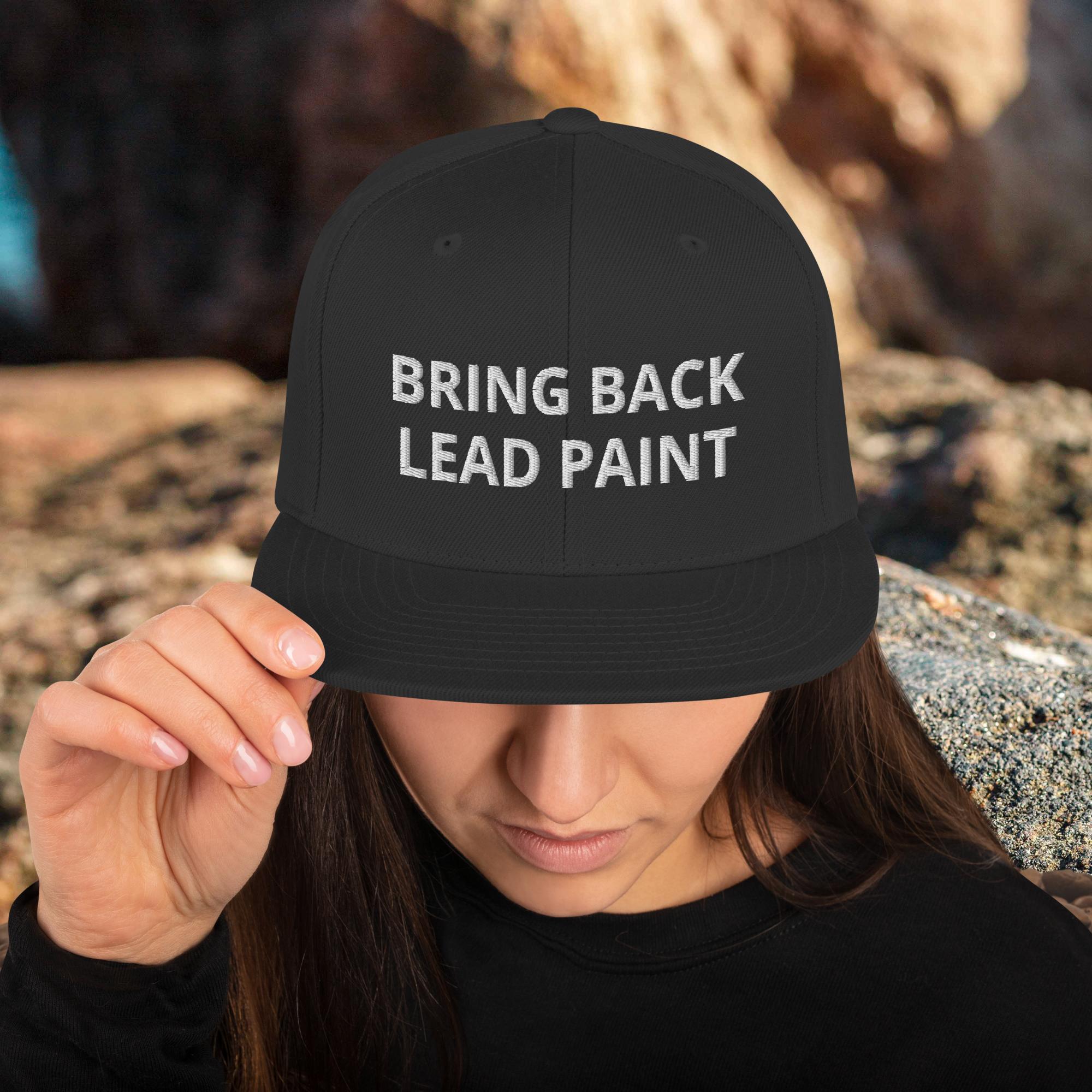 High quality black embroidery on 'Bring Back Lead Paint' snapback. Flat visor view