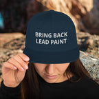 High quality dark-navy embroidery on 'Bring Back Lead Paint' snapback. Flat visor view